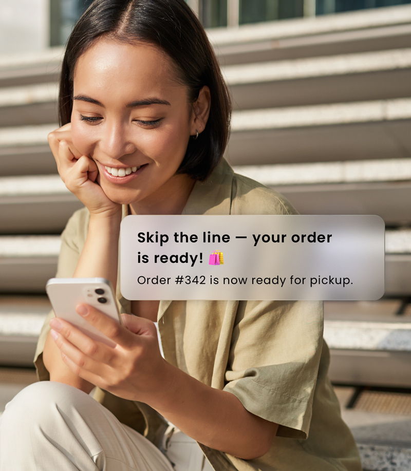 Girl ordering ahead for pick-up on her mobile phone.