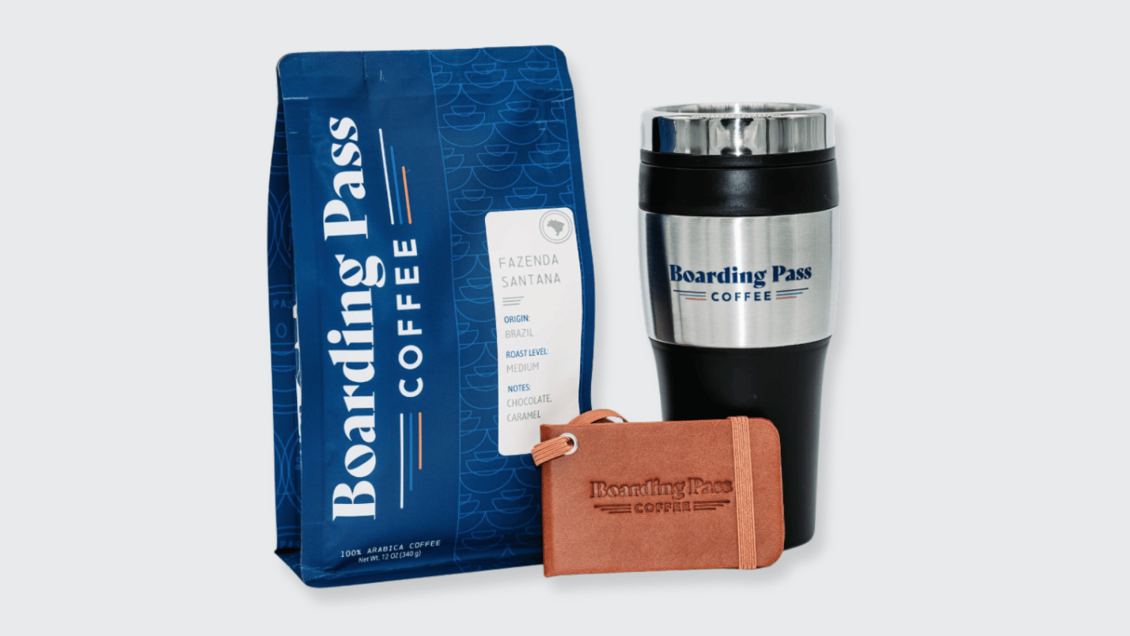 Boarding Pass Coffee branded coffee beans, boarding pass, and travel mug
